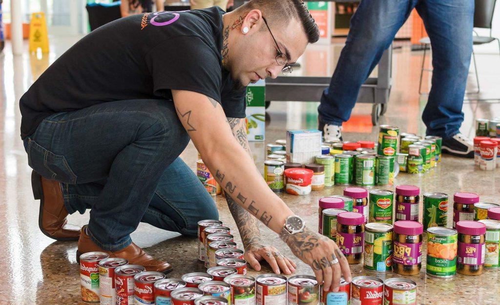 student organizing canned goods