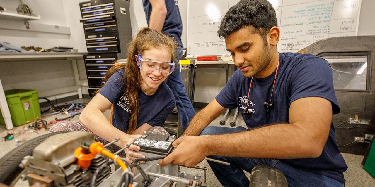 Engineering students work on a project