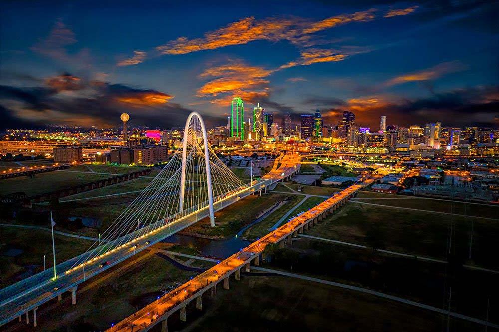 Margaret Hunt Hill Bridge spanning the Trinity River leading toward downtown Dallas.