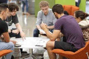 Students seated around a table