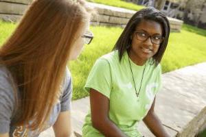 Students talking at TI Plaza